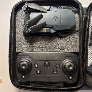 Compact Black and Gray Drone with Controller